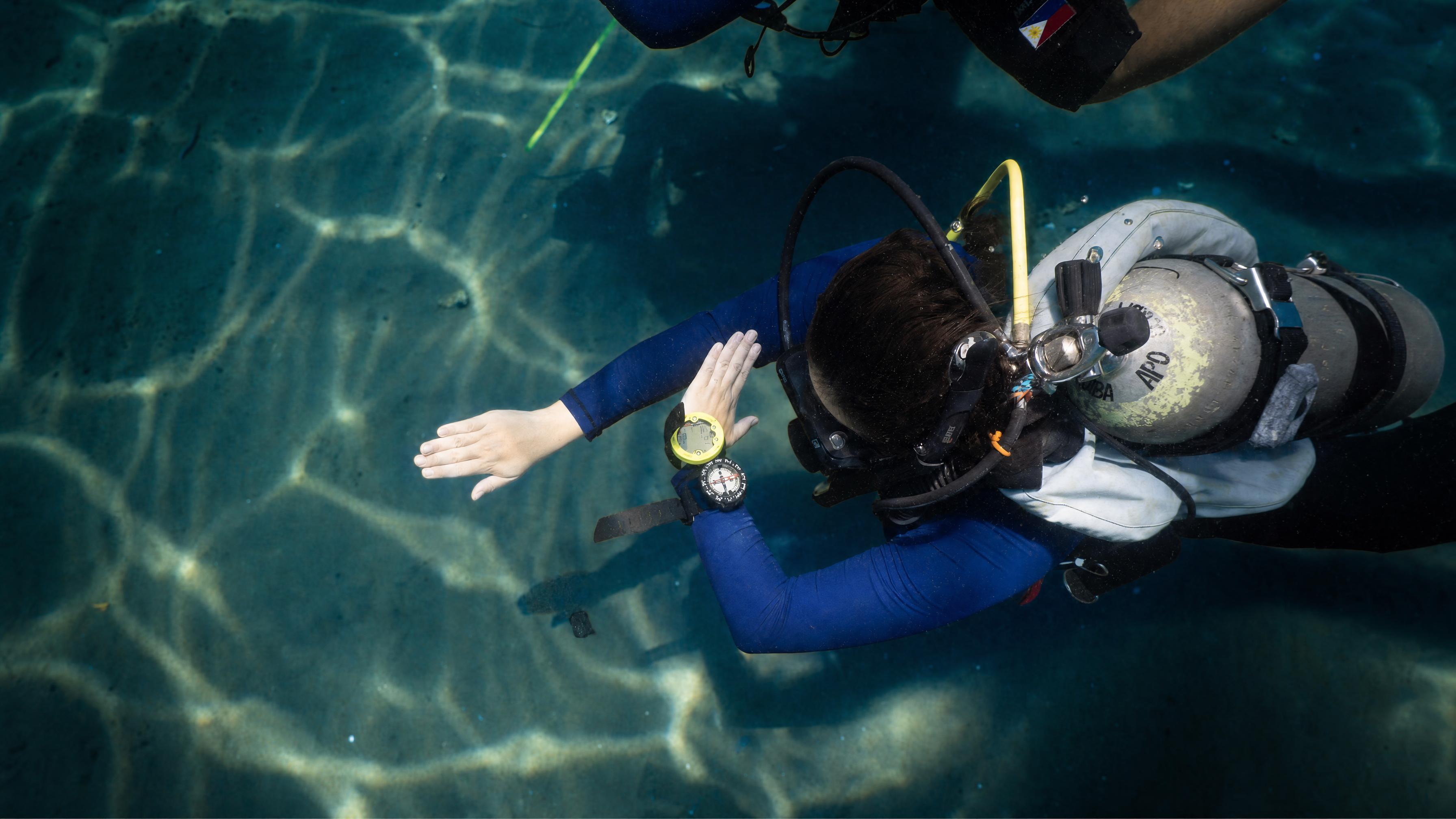 A diver running a navigation exercise on an Advanced Open Water course