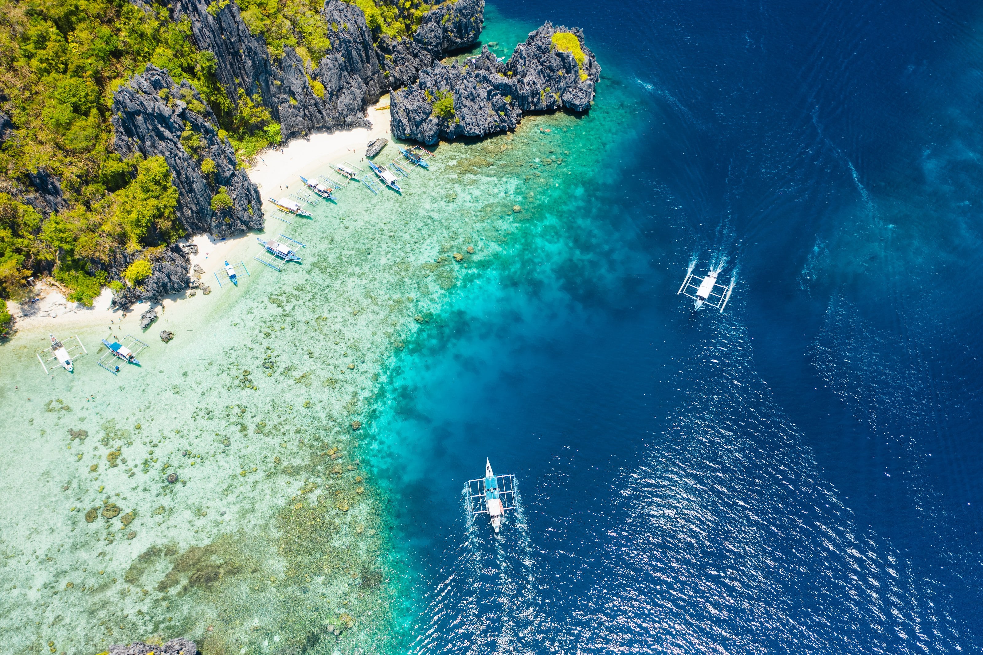 A dive boat crossing open water in the Philippines